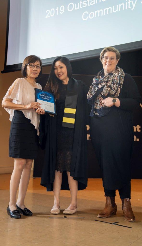 Erika receiving her award at the ceremony