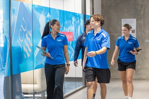 Photo: tstudens walking outside the JCU Performance Science Hub / Credit: Budd Photography