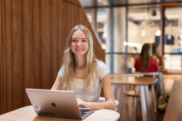 Photo: a student looking at her laptop