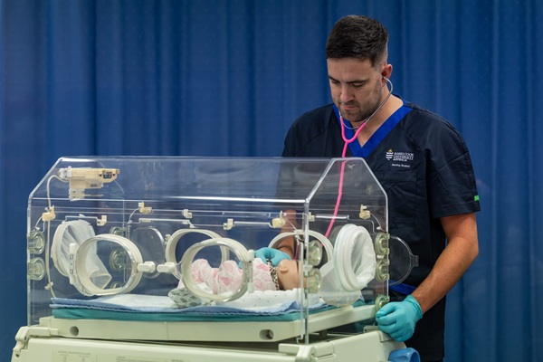 Photo: a nursing student in the simulation lab. Credit: Budd Photography