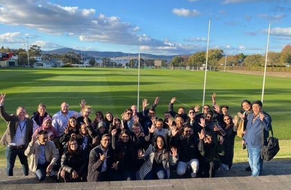 Agents in front of sports oval at Sandy Bay campus